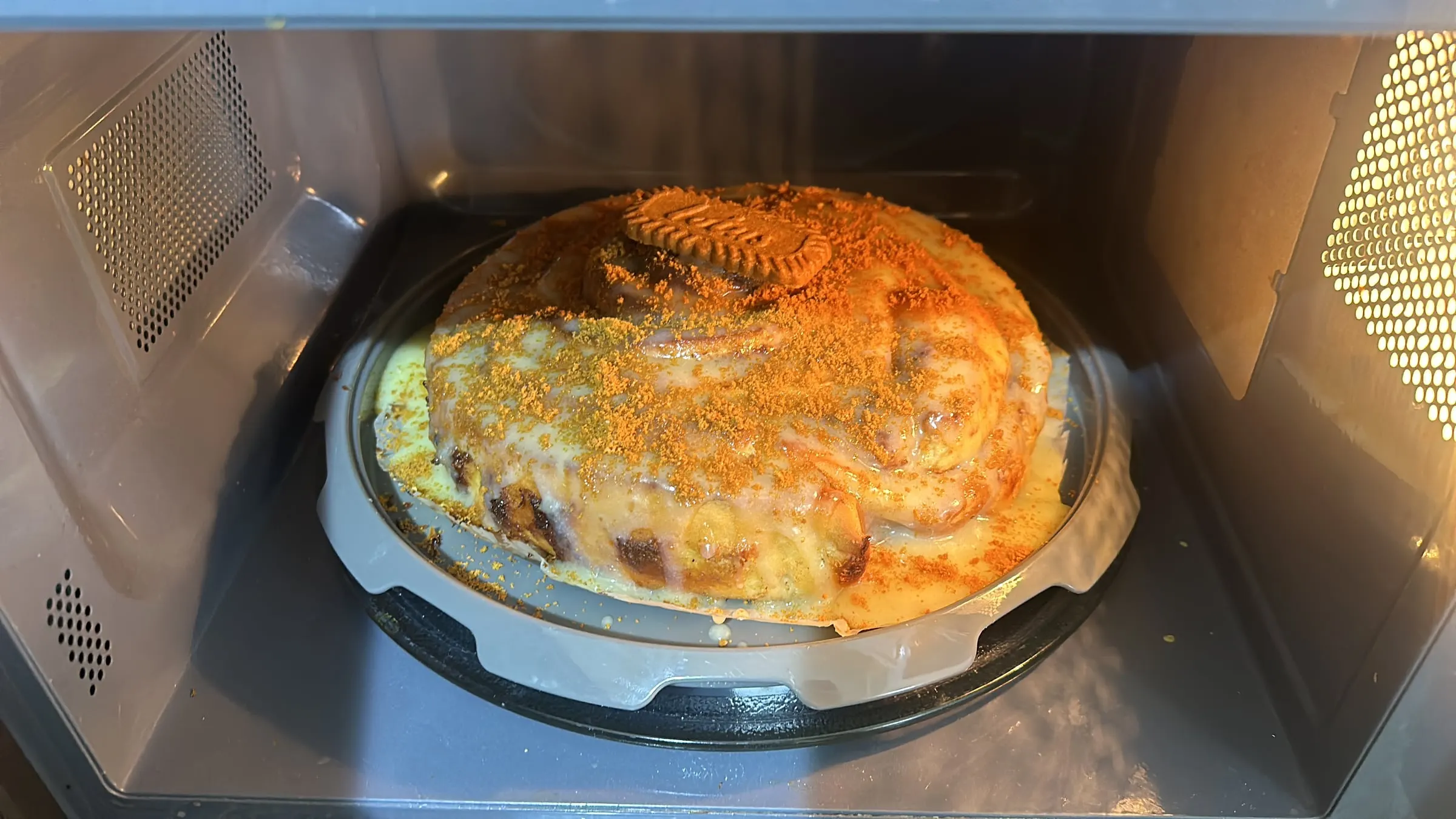A tray of lotus cinnamon rolls baking in the oven
