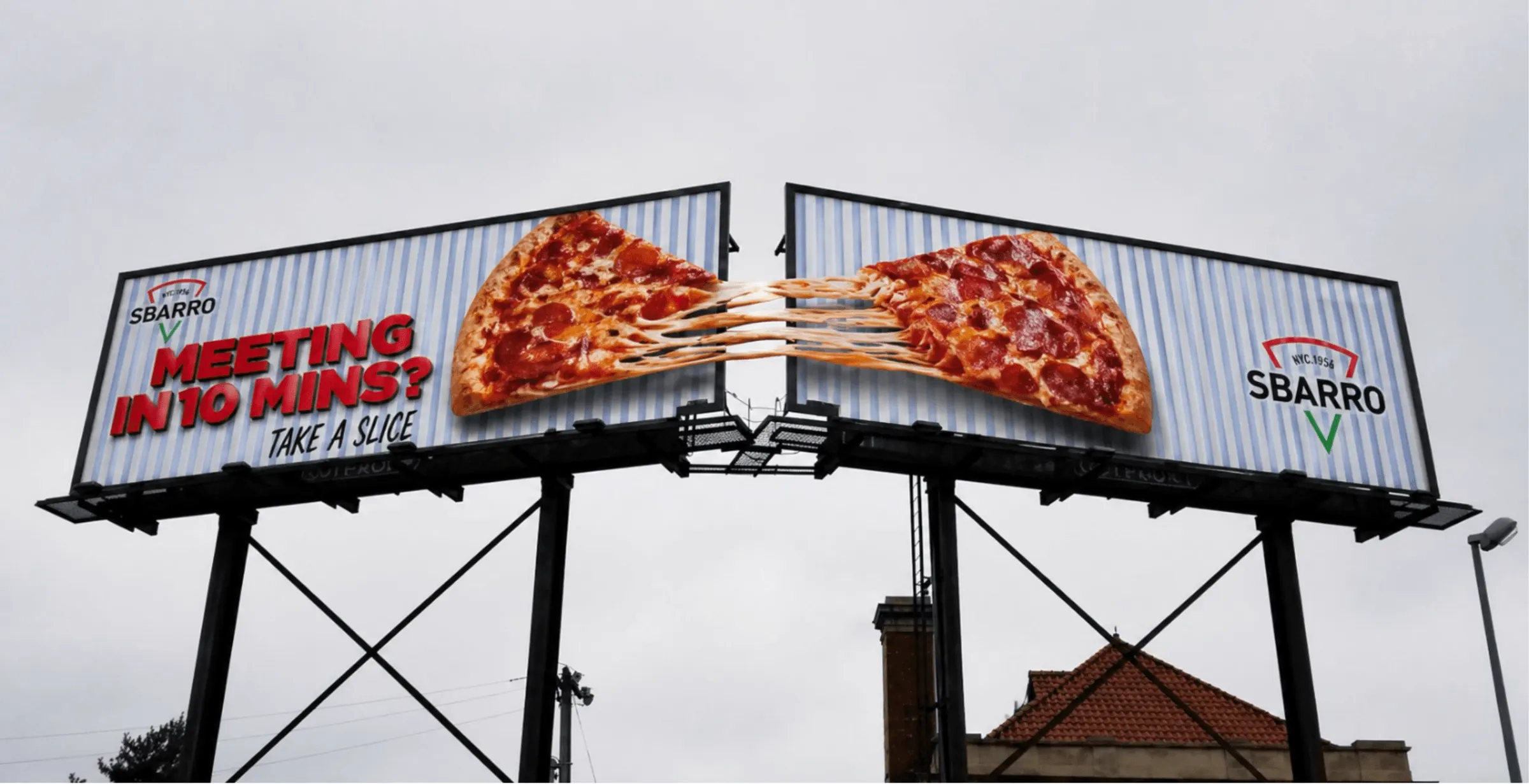 Two roadside billboards side by side: a pepperoni slice is pulled apart across both, cheese stretching between them, under the line “Meeting in 10 mins? Take a slice.”